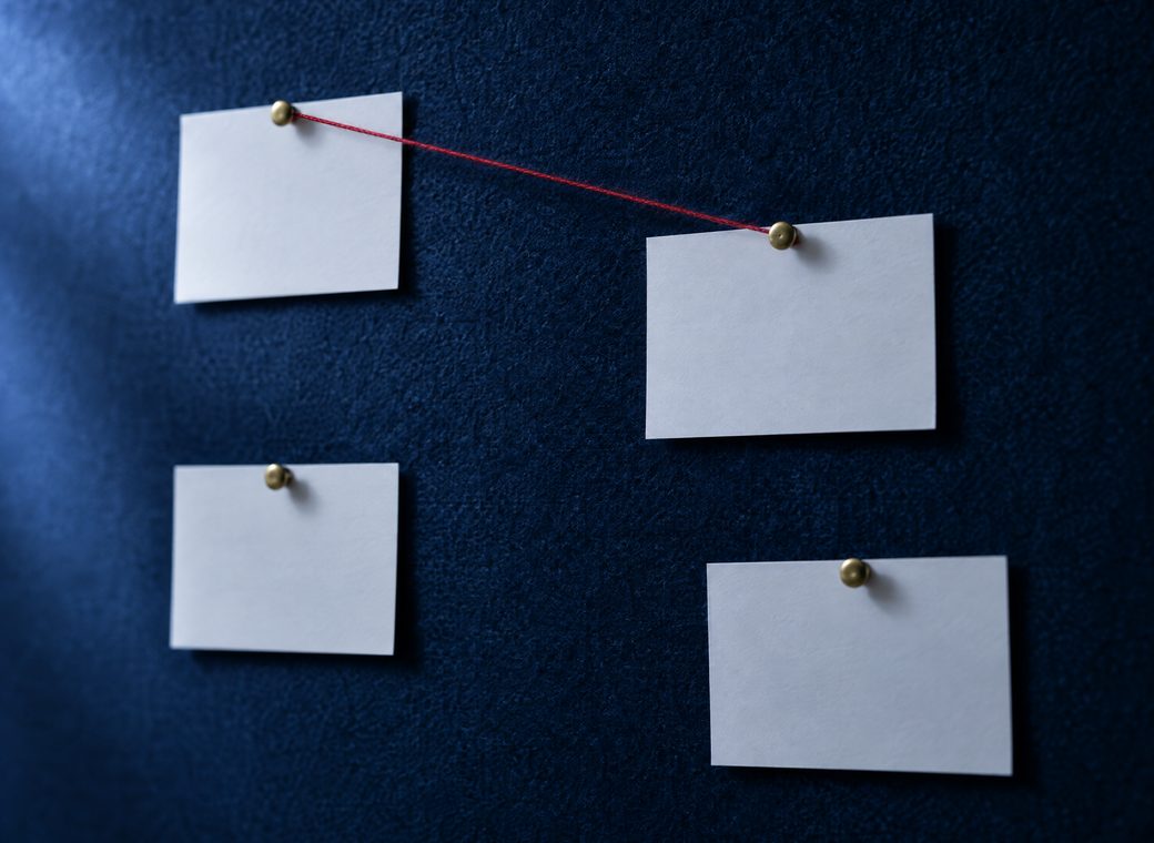 Blank cards pinned to a board